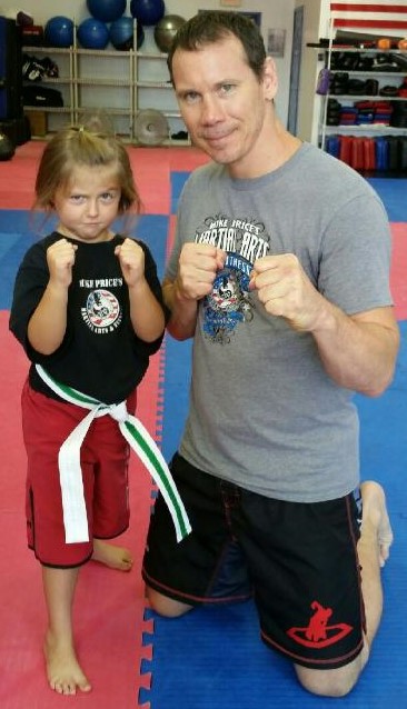 Mike with little girl doing martial arts