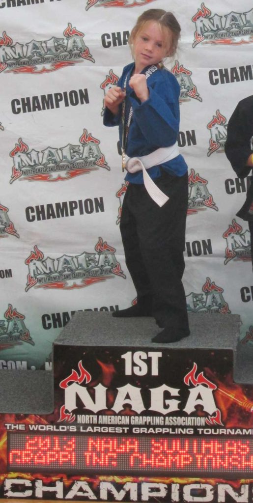 Ava showing off her NAGA championship win