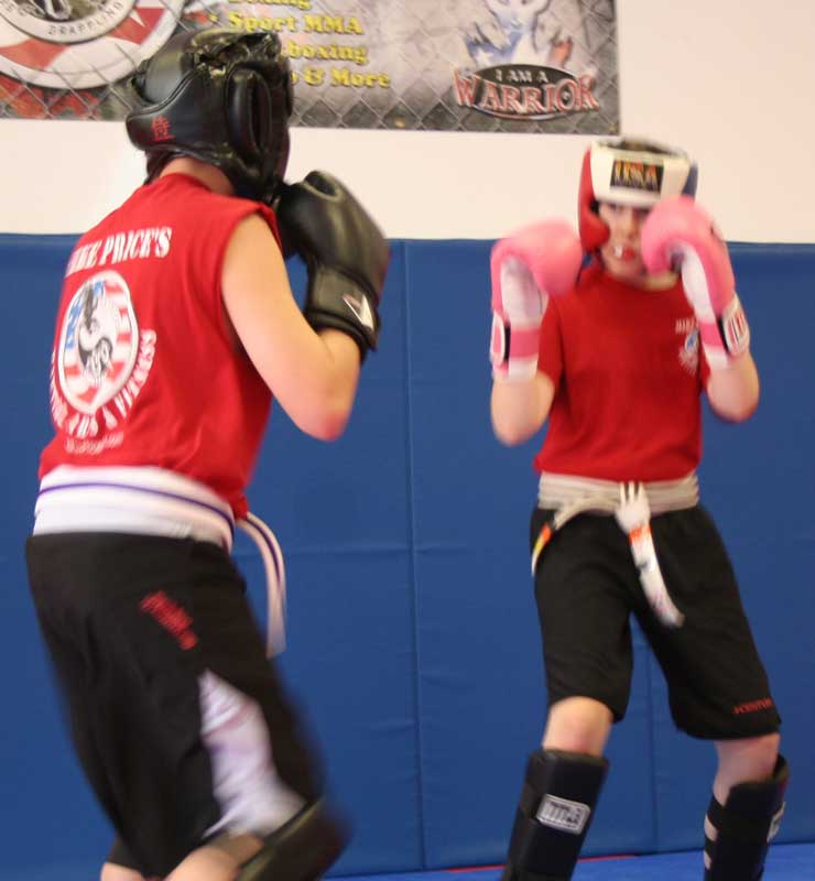 juniors kickboxing during martial arts class