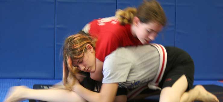 kids preforming guillotine move in martial arts