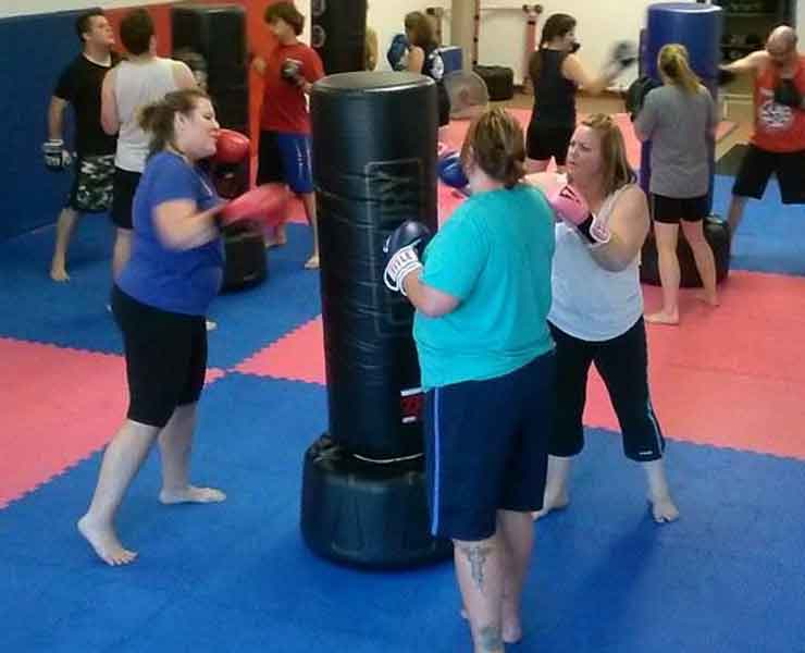 ladies hitting boxing fitness class